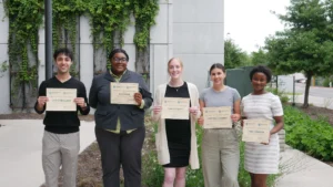 green leaders fellows graduation fellows holding certificates