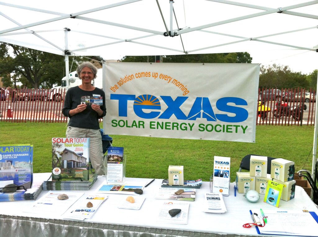 person tabling for sustainable energy texas solar energy society